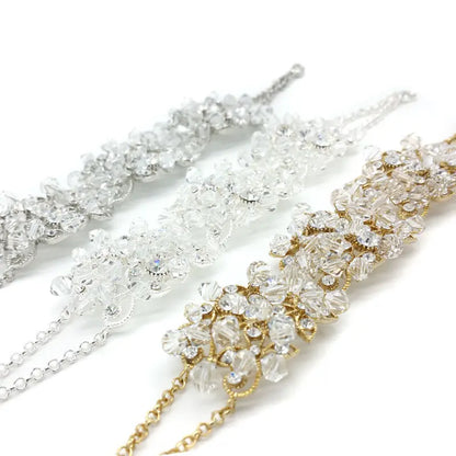 Two decorative headbands with crystal embellishments on a white background