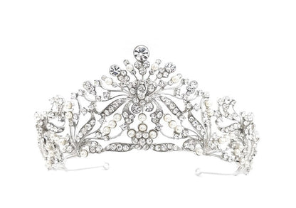 Silver tiara with intricate design on a white background