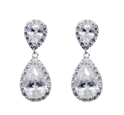 Pair of teardrop-shaped earrings with clear gemstones on a white background