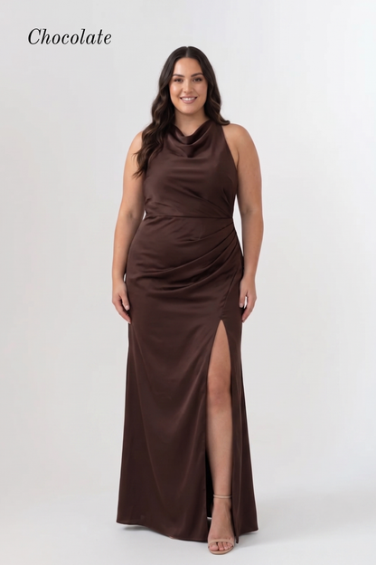 A woman modeling a sleeveless chocolate brown maxi dress with a draped cowl neckline, gathered waist, and high front slit, shown against a light gray studio background with the word 'Chocolate' in the top left.