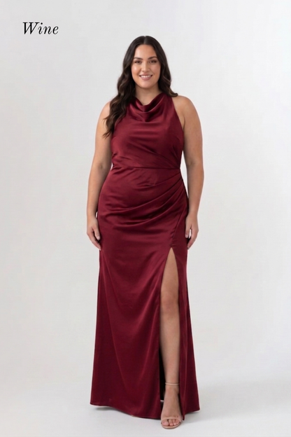 A woman modeling a sleeveless, high-neck, floor-length wine red gown with a draped ruched bodice and a high front slit, shown against a plain light gray studio background. The word 'Wine' appears in the upper left corner.
