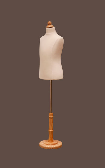 Mannequin torso on a wooden stand against a brown background