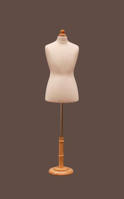 Mannequin torso on a wooden stand against a brown background
