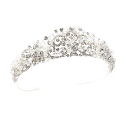 Silver tiara with intricate design on a white background