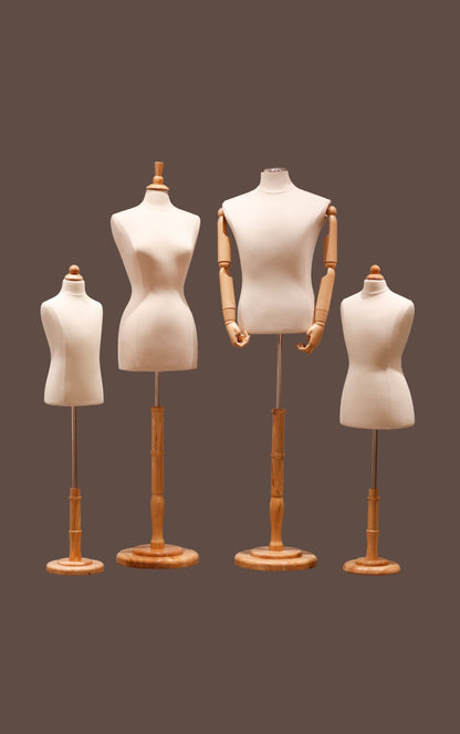 Set of four mannequins with wooden stands on a brown background