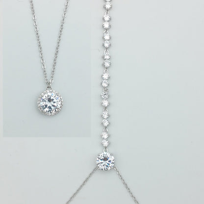 Two diamond necklaces on a light gray background