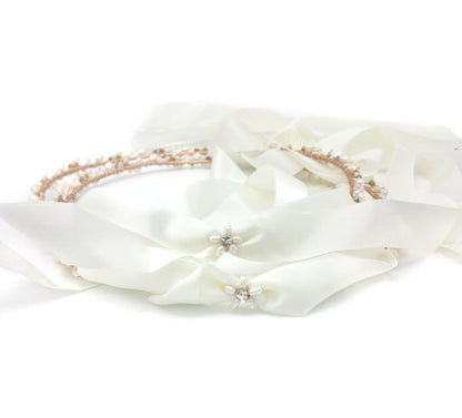 White headband with decorative elements on a white background