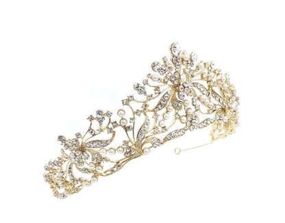 Gold and silver tiara with floral designs on a white background