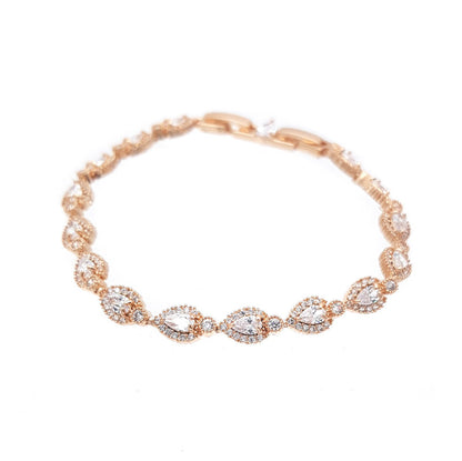 Rose gold bracelet with clear stones on a white background