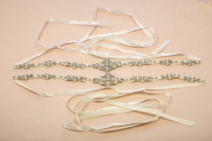 Elegant wedding belt with ribbons on a beige background