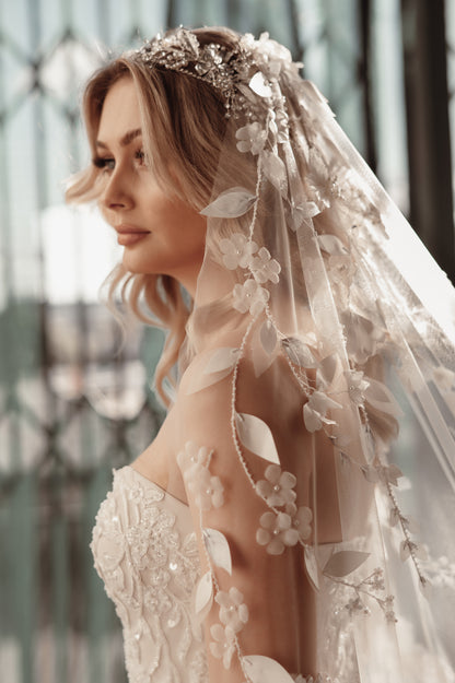 Woman wearing a floral veil with a blurred background