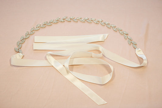 Decorative belt with ribbons on a pink background