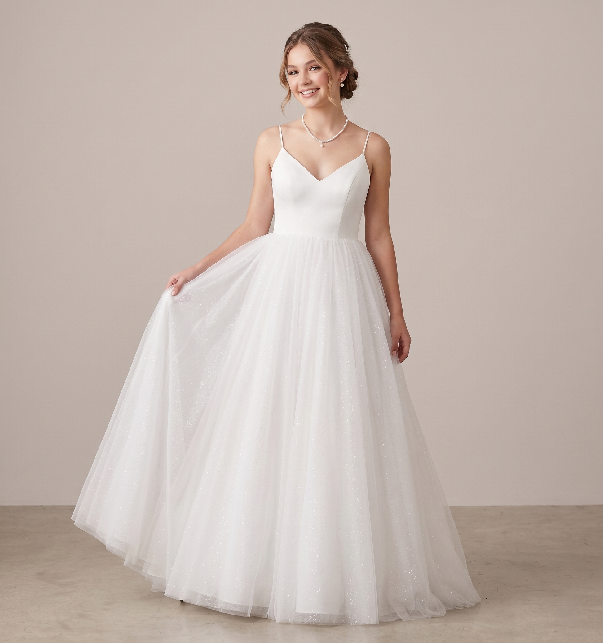 Woman wearing a white wedding dress against a plain background