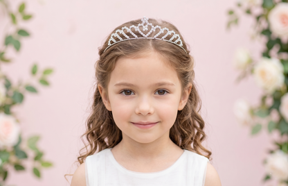 Young girl wearing a tiara with a floral background