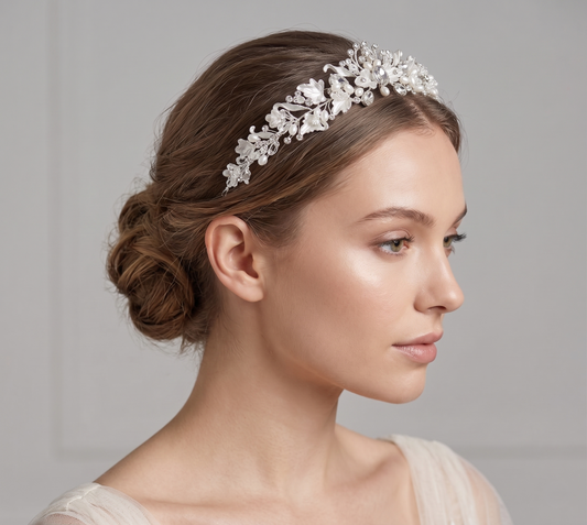 Woman wearing a decorative headband with a plain background