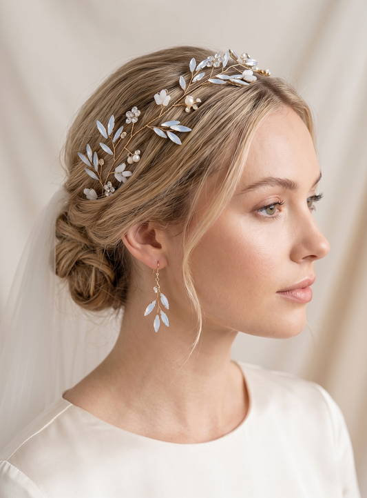 Woman wearing a decorative headband with floral elements and matching earrings.