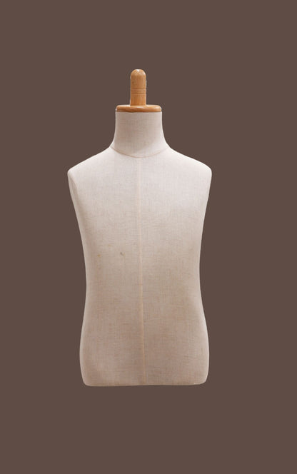 Mannequin torso on a brown background