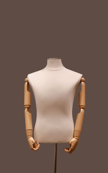 Mannequin torso with wooden arms and legs on a dark background