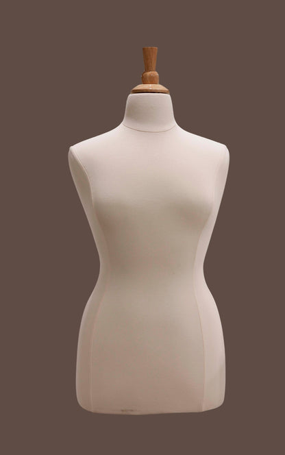 Beige mannequin torso on a dark brown background
