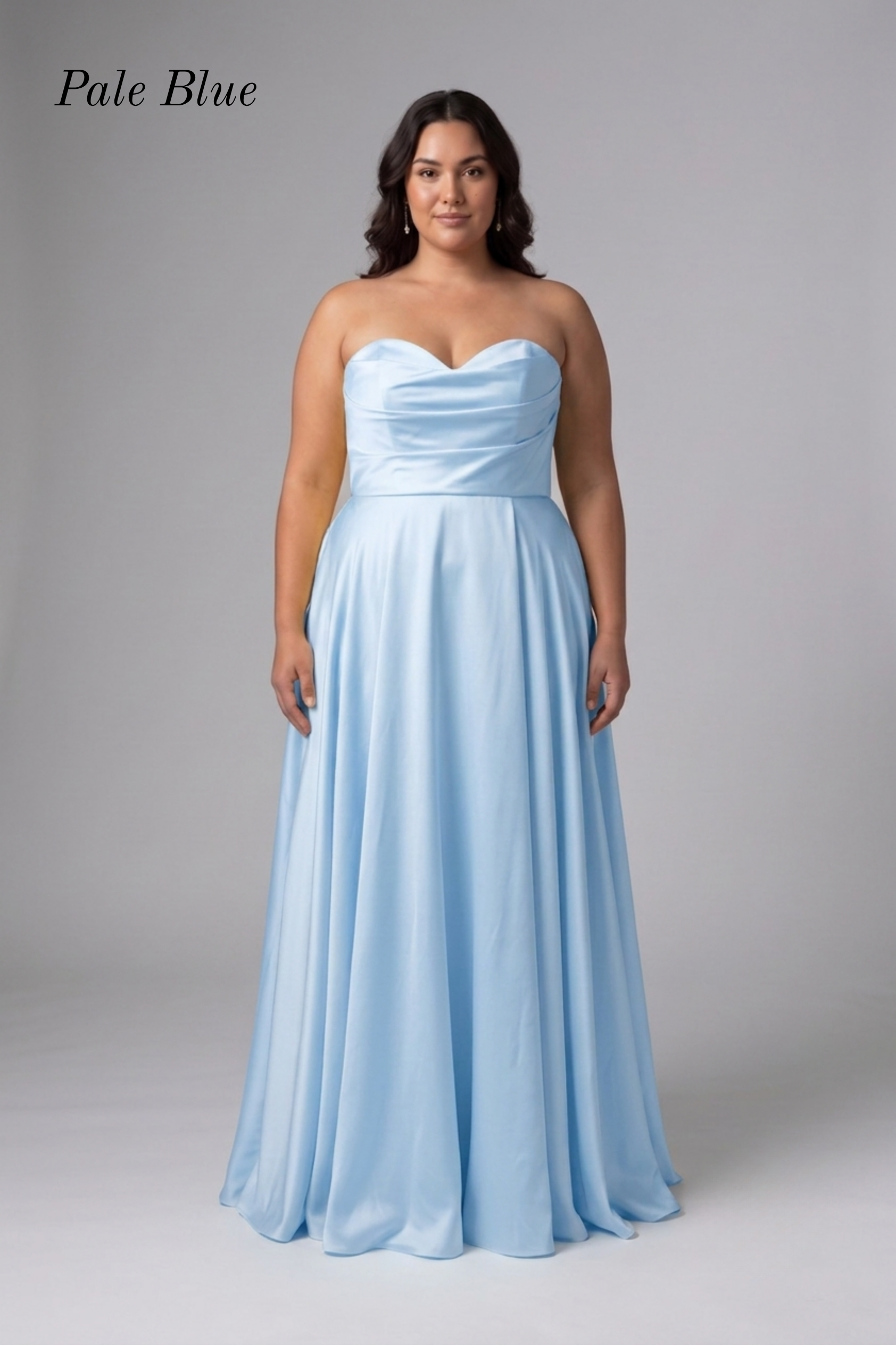 A woman modeling a strapless pale blue floor-length gown against a light gray studio background. The text 'Pale Blue' appears in the upper left corner.
