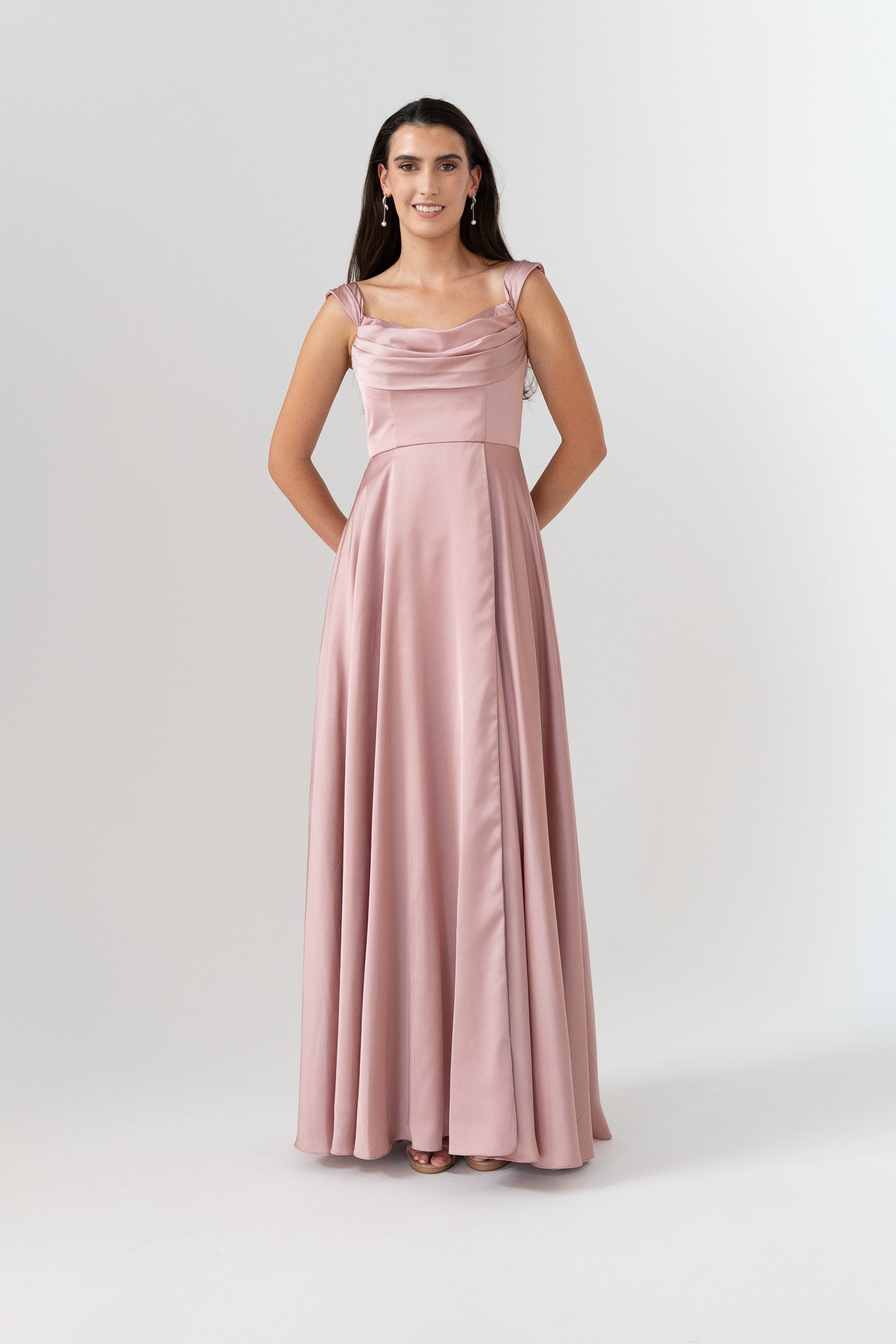 Woman wearing a pink gown on a white background