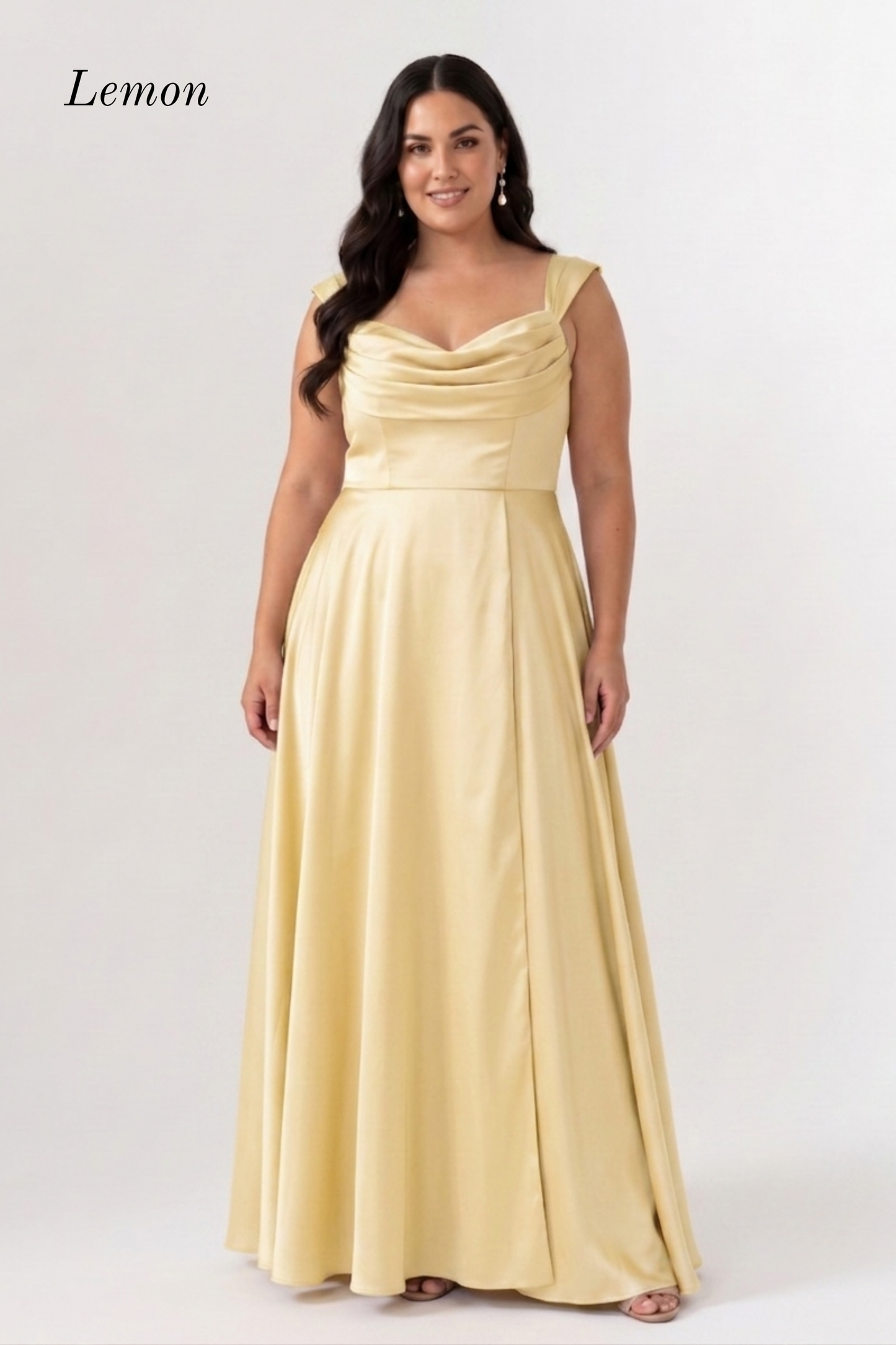 A woman modeling a floor-length satin gown in a pale lemon yellow color, with the word 'Lemon' printed in the upper left corner against a plain light gray studio background.