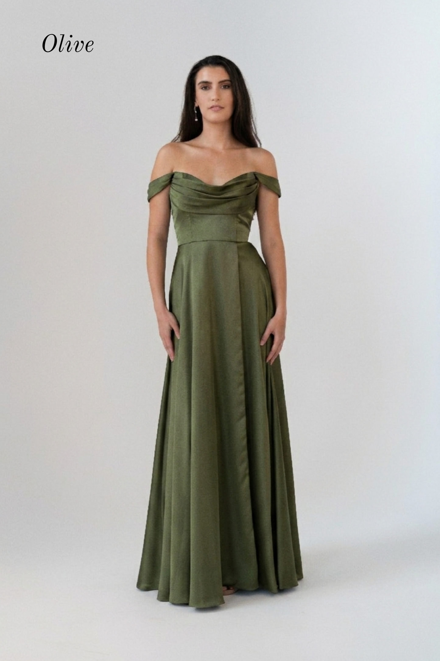A woman modeling an olive green off-the-shoulder floor-length gown against a plain light gray studio background. The word 'Olive' appears in the upper left corner.