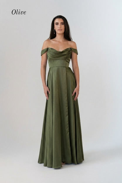 A woman modeling an olive green off-the-shoulder floor-length gown against a plain light gray studio background. The word 'Olive' appears in the upper left corner.