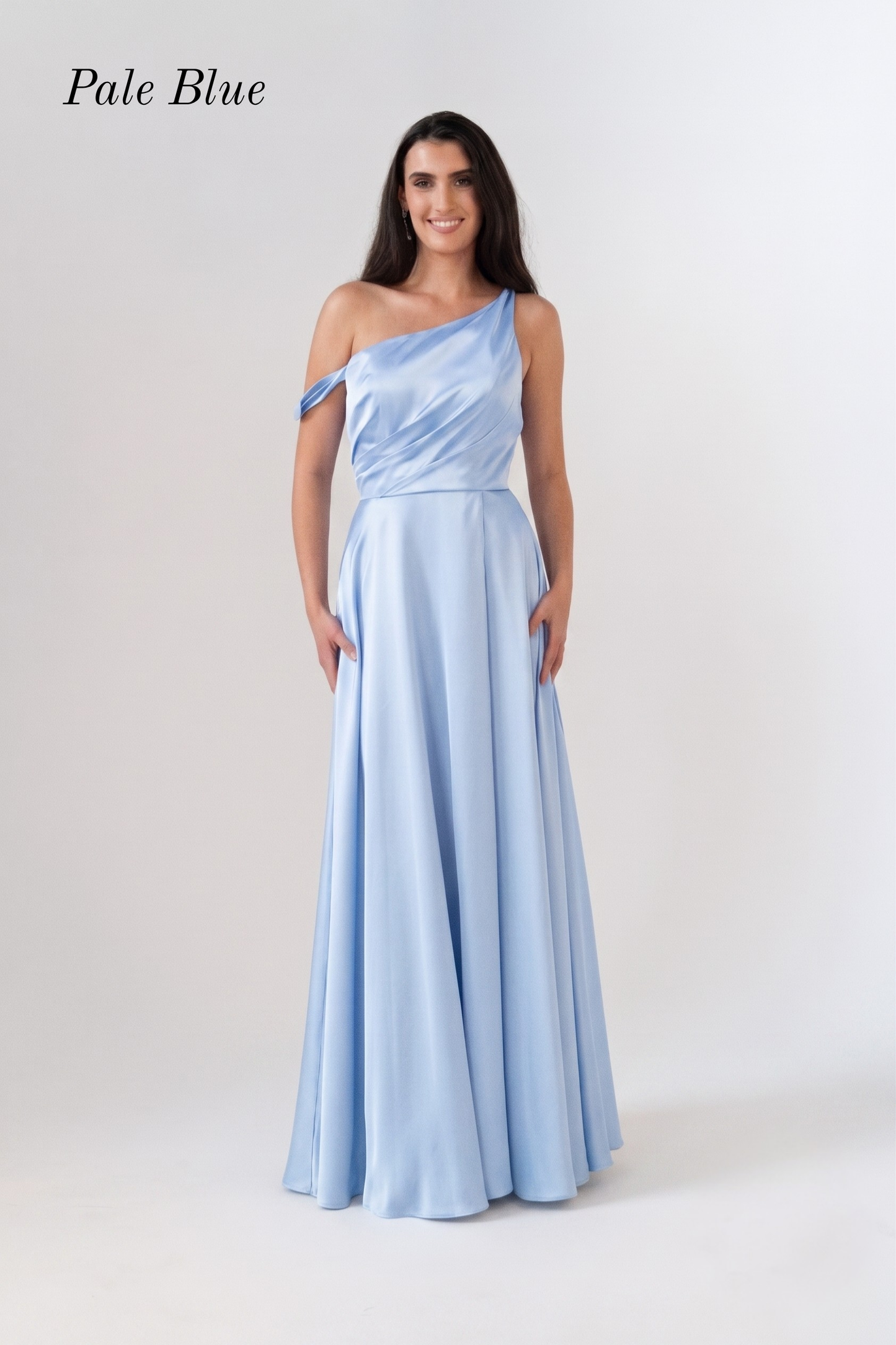 A woman modeling a pale blue one-shoulder floor-length gown against a light gray studio background. The text 'Pale Blue' appears in the upper left corner.