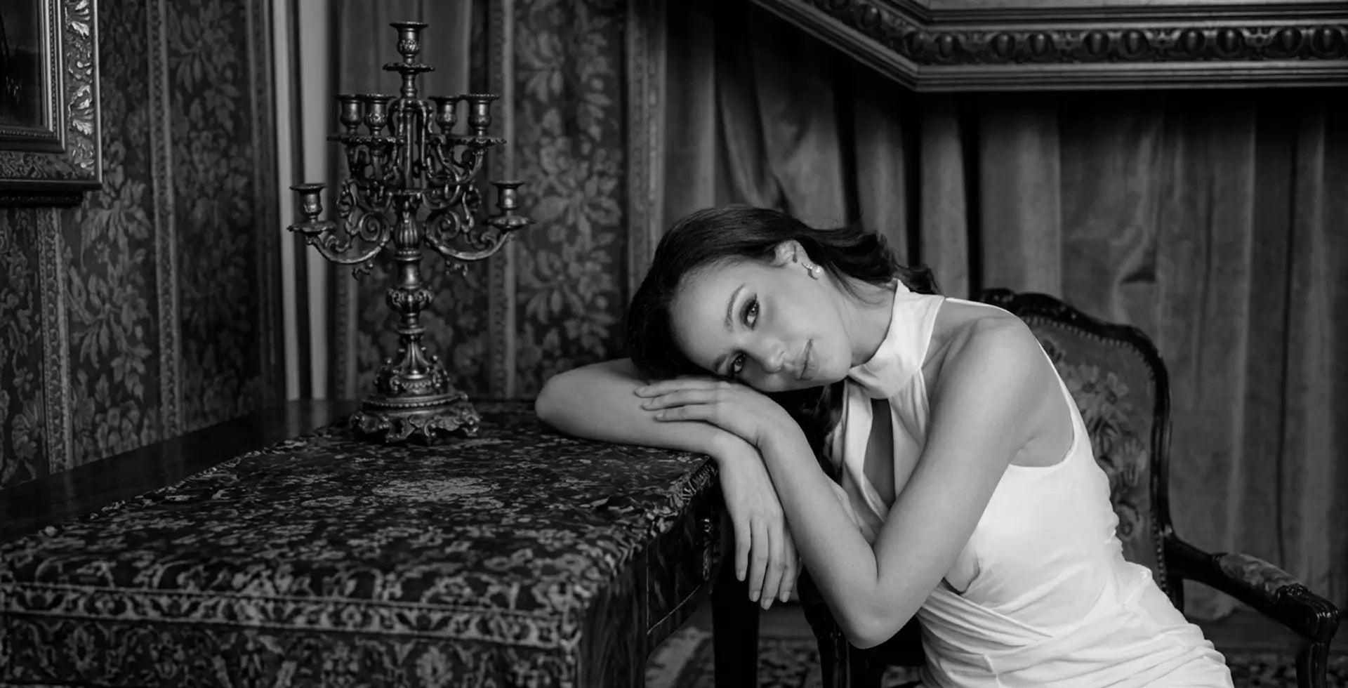 Black and white portrait of bride in elegant gown