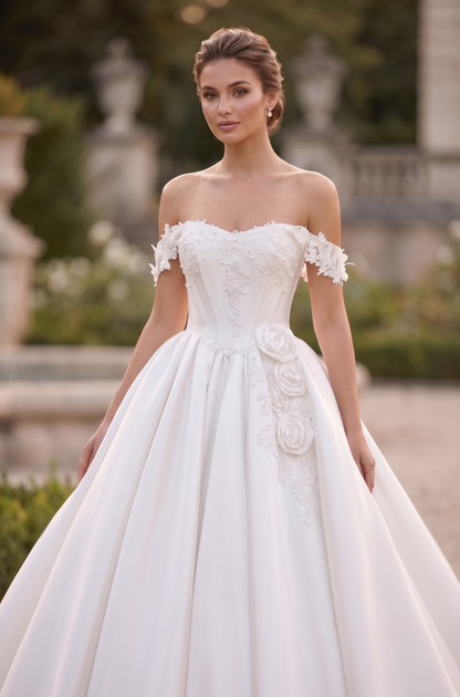 Woman wearing a white wedding dress with floral details in an outdoor setting.