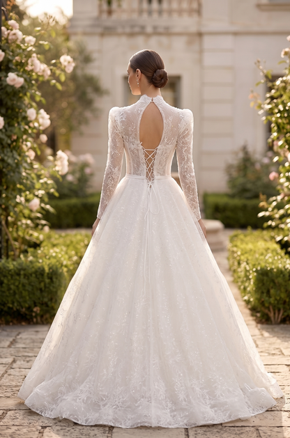 Woman in a white lace wedding dress standing in a garden setting