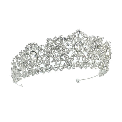 Silver tiara with intricate design on a white background