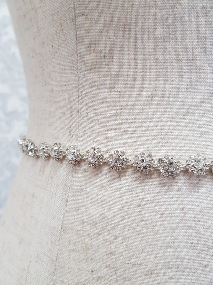 Silver bracelet on a mannequin with a neutral background