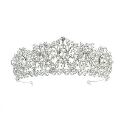 Silver tiara with intricate design on a white background