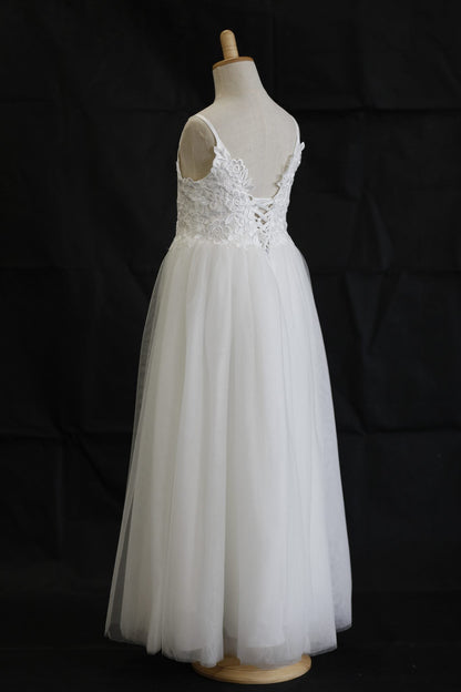 White lace dress on a mannequin against a black background