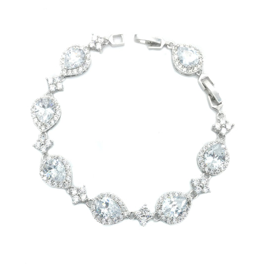 Silver bracelet with clear gemstones on a white background