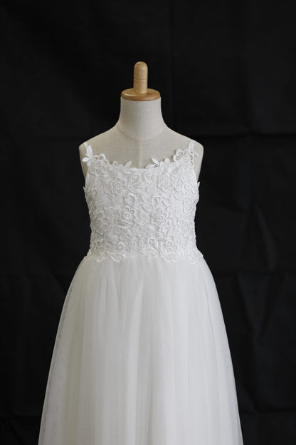 White wedding dress on a mannequin against a black background
